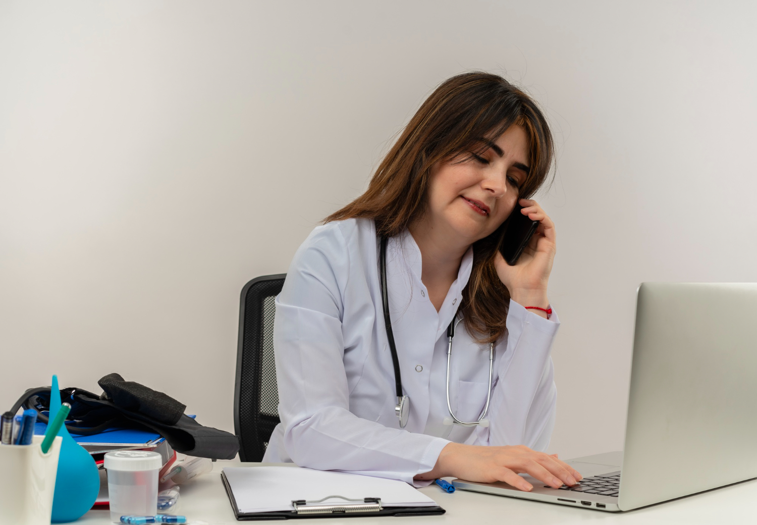 Healthcare administrative professional at a front desk